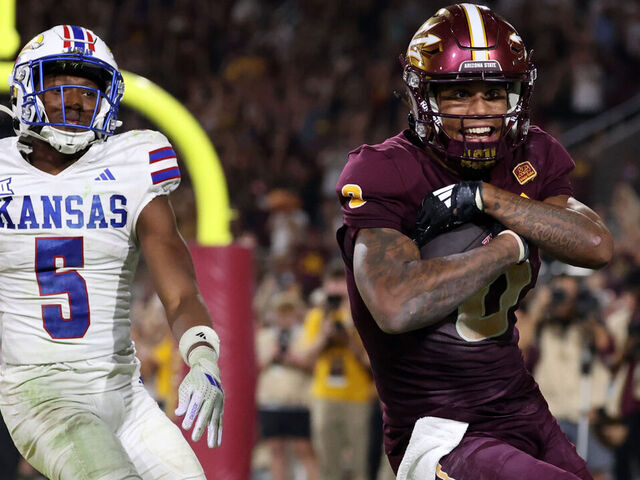 TEMPE, ARIZONA - OCTOBER 05: Wide receiver Jordyn Tyson #0 of the Arizona State Sun Devils celebrates after scoring the go ahead touchdown over safety O.J. Burroughs #5 of the Kansas Jayhawks during the fourth quarter at Mountain America Stadium on October 05, 2024 in Tempe, Arizona.