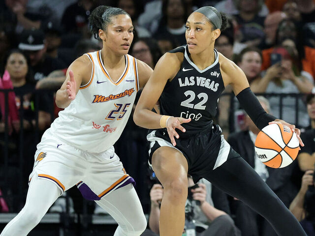 LAS VEGAS, NEVADA - AUGUST 21: A'ja Wilson #22 of the Las Vegas Aces is guarded by Alyssa Thomas #25 of the Phoenix Mercury in the second quarter of their game at Michelob ULTRA Arena on August 21, 2025 in Las Vegas, Nevada. The Aces defeated the Mercury 83-61.