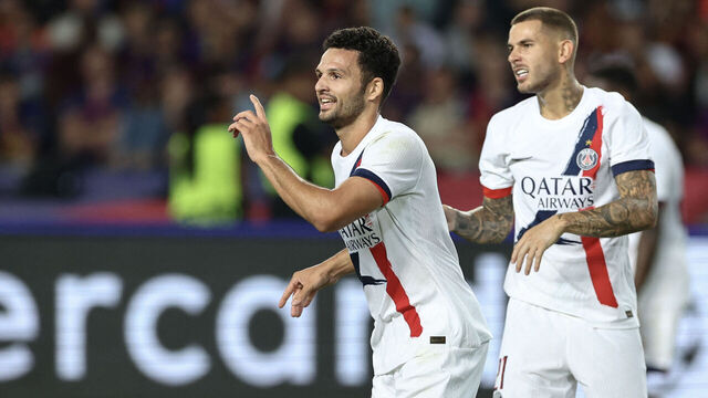 Paris Saint-Germain's Portuguese forward #09 Goncalo Ramos (L) celebrates scoring their second goal during the UEFA Champions League league phase day 2 football match between FC Barcelona and Paris Saint-Germain (PSG) at the Estadi Olimpic Lluis Companys in Barcelona, on October 1, 2025.