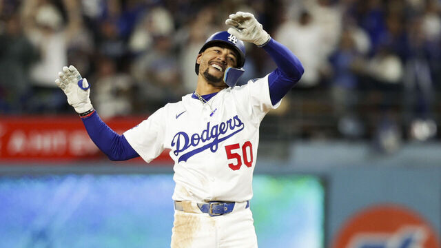 LOS ANGELES, CA - OCTOBER 01: Mookie Betts #50 of the Los Angeles Dodgers reacts after hitting a RBI double in the bottom of the sixth inning during Game Two of the National League Wild Card Series between the Cincinnati Reds and the Los Angeles Dodgers at Dodger Stadium on Wednesday, October 1, 2025 in Los Angeles, California.