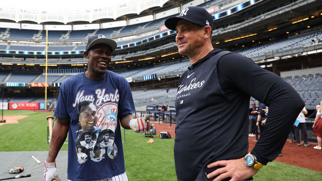 NEW YORK, NY - JUNE 08: Jazz Chisholm Jr. #13 talks to Manager, Aaron Boone #17 of the New York Yankees before the game against the Boston Red Sox at Yankee Stadium on June 08, 2025 in New York, New York.