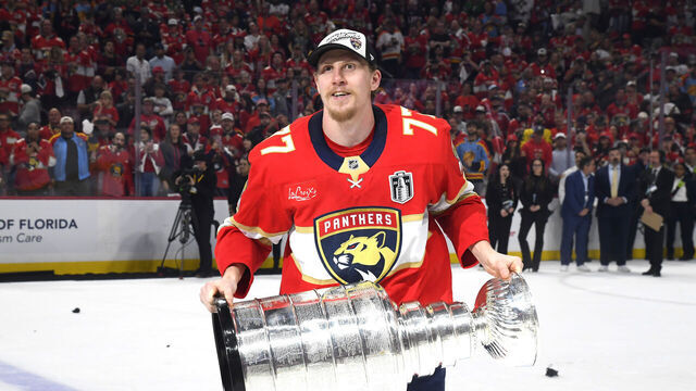 SUNRISE, FLORIDA - JUNE 17: Niko Mikkola #77 of the Florida Panthers celebrates with the Stanley Cup after Game Six of the 2025 Stanley Cup Final between the Edmonton Oilers and the Florida Panthers at Amerant Bank Arena on June 17, 2025 in Sunrise, Florida. The Panthers won the Stanley Cup Final series 4-2.