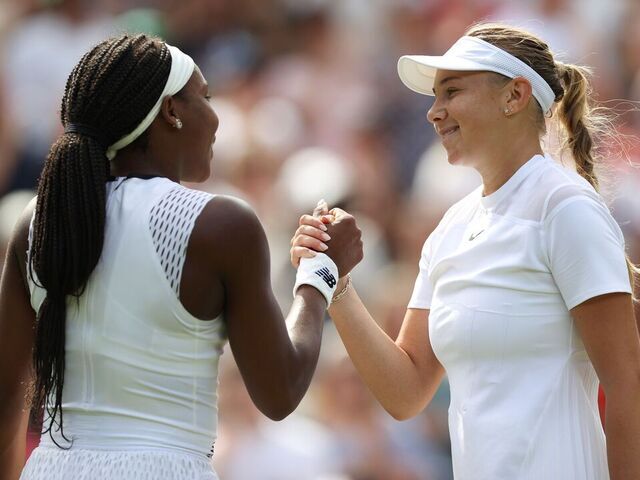 Amanda Anisimova R greets Coco Gauff after the women's singles third round match between Amanda Anisimova and Coco Gauff of the United States at Wimbledon Tennis Championship in London, Britain, on July 2, 2022.