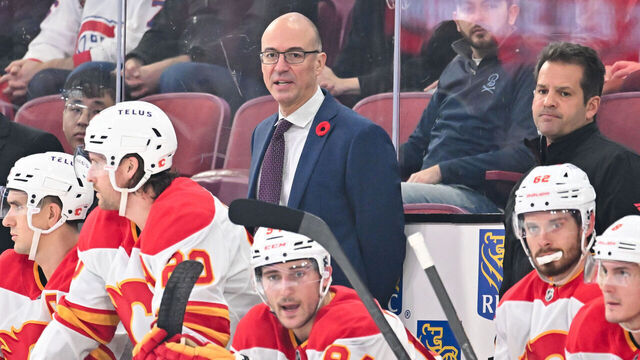MONTREAL, CANADA - NOVEMBER 05: Head coach Ryan Huska of the Calgary Flames handles bench duties during the second period against the Montreal Canadiens at the Bell Centre on November 5, 2024 in Montreal, Quebec, Canada. The Calgary Flames defeated the Montreal Canadiens 3-2 in overtime.