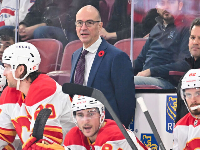 MONTREAL, CANADA - NOVEMBER 05: Head coach Ryan Huska of the Calgary Flames handles bench duties during the second period against the Montreal Canadiens at the Bell Centre on November 5, 2024 in Montreal, Quebec, Canada. The Calgary Flames defeated the Montreal Canadiens 3-2 in overtime.
