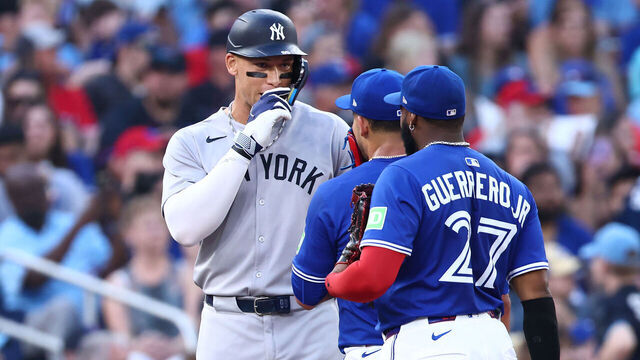 TORONTO, ON - JULY 02: Aaron Judge #99 of the New York Yankees talks to José Berríos #17 and Vladimir Guerrero Jr. #27 of the Toronto Blue Jays during a game at Rogers Centre on July 02, 2025 in Toronto, Ontario, Canada.