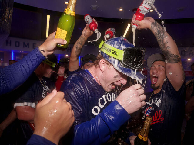 CHICAGO, ILLINOIS - OCTOBER 2: Pete Crow-Armstrong #4 of the Chicago Cubs celebrates in the clubhouse after winning Game Three of the National League Wild Card Game against the San Diego Padres at Wrigley Field on October 2, 2025 in Chicago, Illinois.