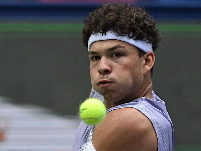 USA's Ben Shelton hits a return to Belgium's David Goffin during their men's singles match at the Shanghai Masters tennis tournament in Shanghai on October 3, 2025.