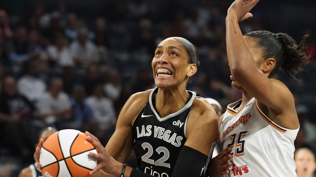 LAS VEGAS, NEVADA - OCTOBER 03: A'ja Wilson #22 of the Las Vegas Aces drives to the basket against Alyssa Thomas #25 of the Phoenix Mercury in the first quarter of Game One of the 2025 WNBA Playoffs finals at Michelob ULTRA Arena on October 03, 2025 in Las Vegas, Nevada.