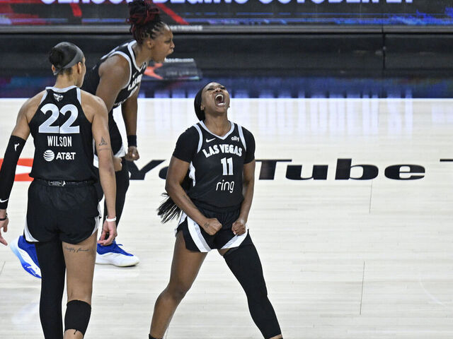 LAS VEGAS, NV - OCTOBER 3: Dana Evans #11 and Chelsea Gray #12 of the Las Vegas Aces celebrates during the game against the Phoenix Mercury during Game 1 of the 2025 WNBA Finals on October 3, 2025 at Michelob ULTRA Arena n Las Vegas, Nevada. Mandatory Copyright Notice: Copyright 2025 NBAE