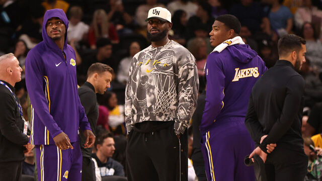 PALM SPRINGS, CALIFORNIA - OCTOBER 03: Jarred Vanderbilt #2, LeBron James #23, and Rui Hachimura #28 of the Los Angeles Lakers looks on during a timeout in the second half of a game against the Phoenix Suns at Acrisure Arena on October 03, 2025 in Palm Springs, California.