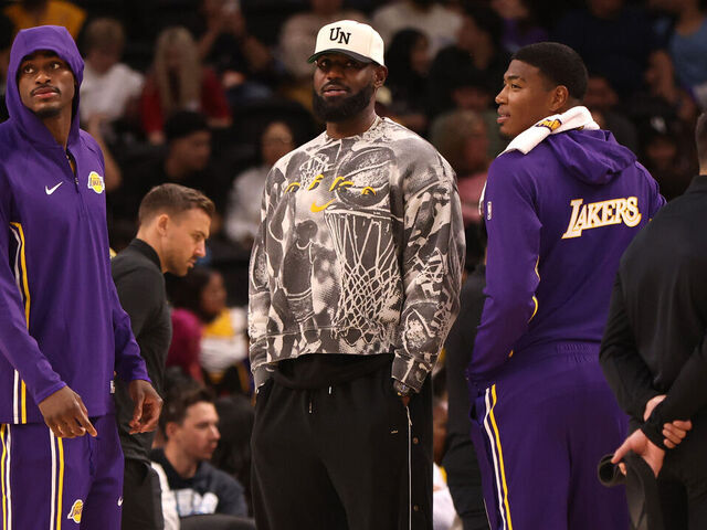 PALM SPRINGS, CALIFORNIA - OCTOBER 03: Jarred Vanderbilt #2, LeBron James #23, and Rui Hachimura #28 of the Los Angeles Lakers looks on during a timeout in the second half of a game against the Phoenix Suns at Acrisure Arena on October 03, 2025 in Palm Springs, California.
