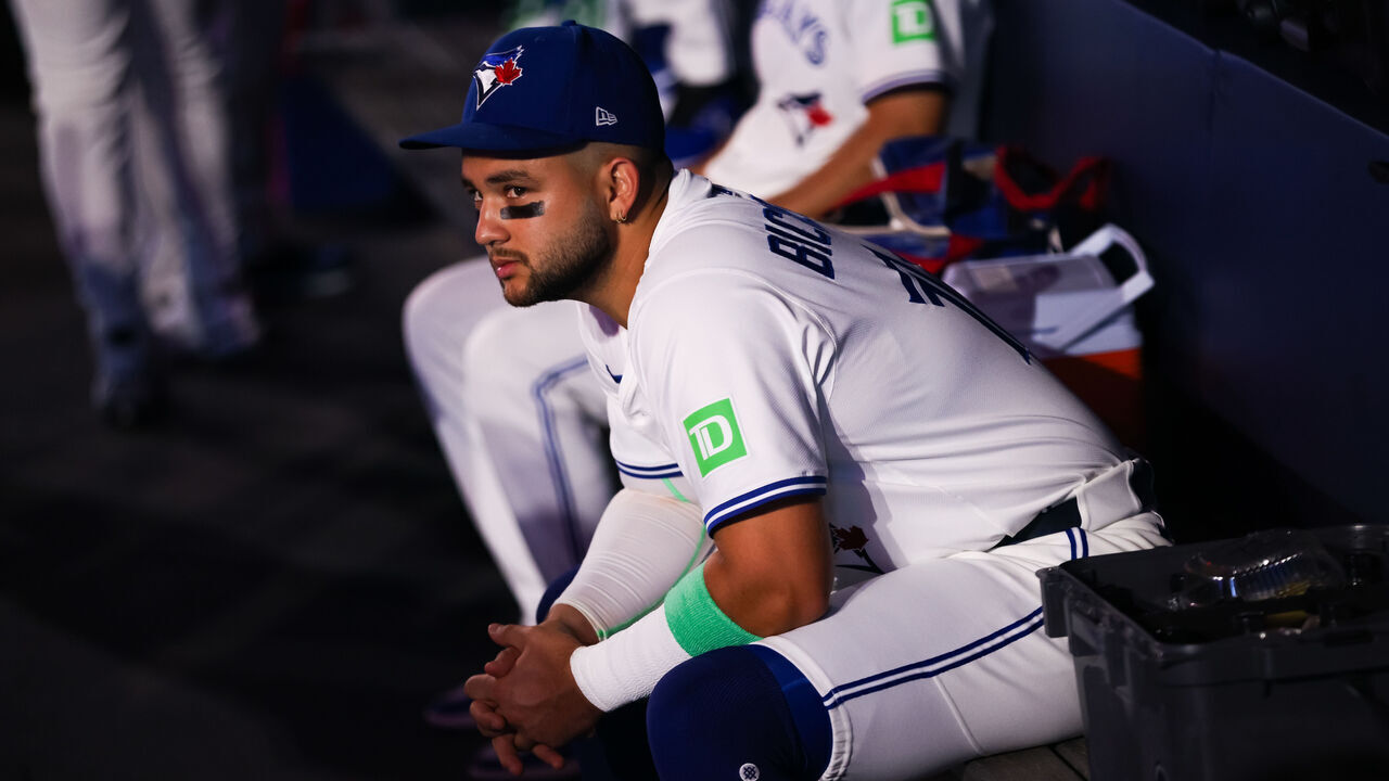 TORONTO, CANADA - AUGUST 17: Bo Bichette #11 of the Toronto Blue Jays sits in the dugout ahead of the MLB game against the Texas Rangers at Rogers Centre on August 17, 2025 in Toronto, Ontario, Canada.