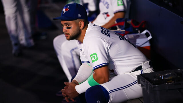 TORONTO, CANADA - AUGUST 17: Bo Bichette #11 of the Toronto Blue Jays sits in the dugout ahead of the MLB game against the Texas Rangers at Rogers Centre on August 17, 2025 in Toronto, Ontario, Canada.
