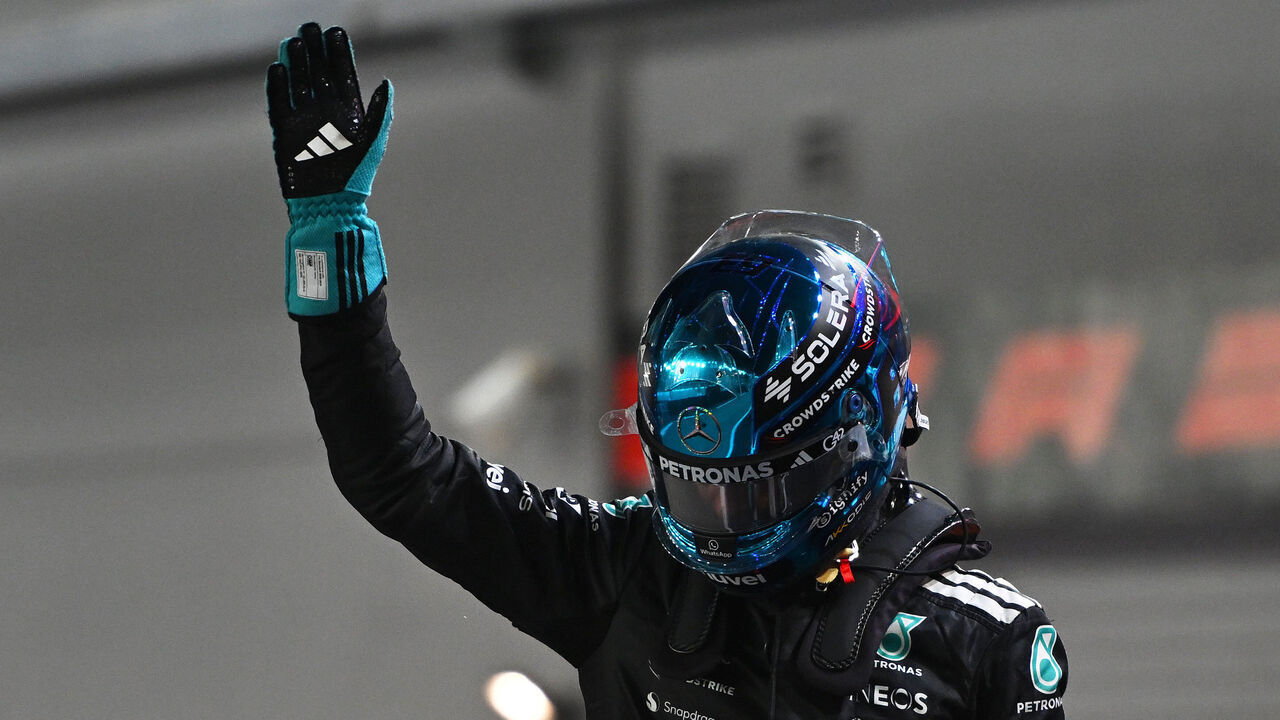 SINGAPORE, SINGAPORE - OCTOBER 04: Pole position qualifier George Russell of Great Britain and Mercedes AMG Petronas F1 Team celebrates on arrival in parc ferme during qualifying ahead of the F1 Grand Prix of Singapore at Marina Bay Street Circuit on October 04, 2025 in Singapore, Singapore.
