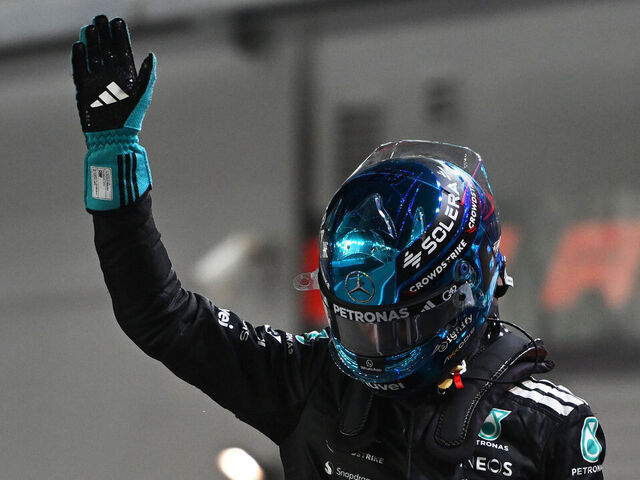 SINGAPORE, SINGAPORE - OCTOBER 04: Pole position qualifier George Russell of Great Britain and Mercedes AMG Petronas F1 Team celebrates on arrival in parc ferme during qualifying ahead of the F1 Grand Prix of Singapore at Marina Bay Street Circuit on October 04, 2025 in Singapore, Singapore.