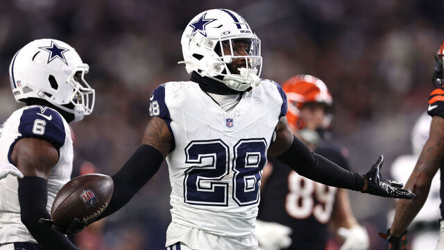ARLINGTON, TEXAS - DECEMBER 09: Malik Hooker #28 of the Dallas Cowboys celebrates after an interception against the Cincinnati Bengals during the third quarter in the game at AT&T Stadium on December 09, 2024 in Arlington, Texas.