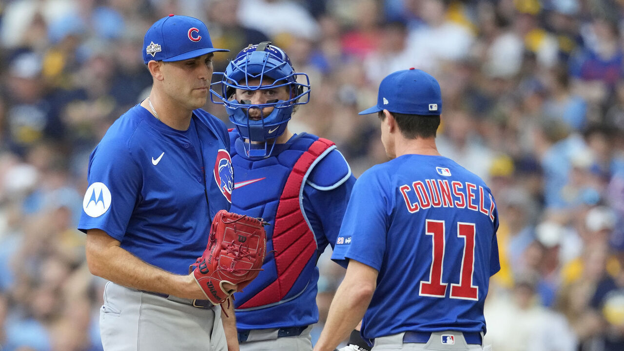 MILWAUKEE, WISCONSIN - OCTOBER 04: Manager Craig Counsell #11 of the Chicago Cubs pulls Matthew Boyd #16 from the game during the first inning against the Milwaukee Brewers in game one of the Division Series at American Family Field on October 04, 2025 in Milwaukee, Wisconsin.