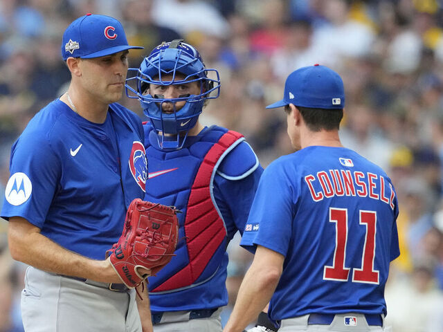 MILWAUKEE, WISCONSIN - OCTOBER 04: Manager Craig Counsell #11 of the Chicago Cubs pulls Matthew Boyd #16 from the game during the first inning against the Milwaukee Brewers in game one of the Division Series at American Family Field on October 04, 2025 in Milwaukee, Wisconsin.