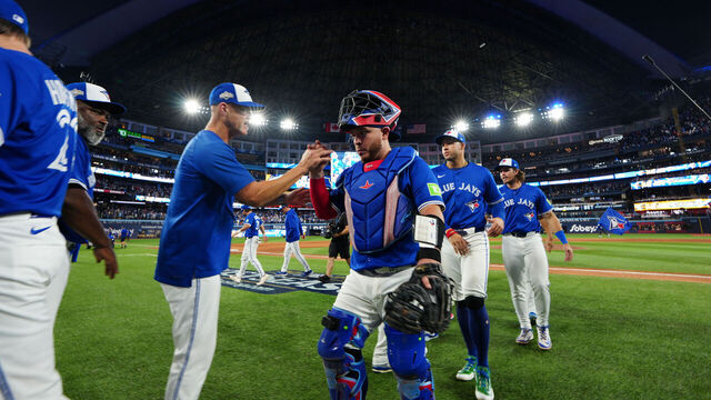 TORONTO, ON - OCTOBER 04: Alejandro Kirk #30 of the Toronto Blue Jays celebrates with teammates after winning Game One of the American League Division Series presented by Booking.com between the New York Yankees and the Toronto Blue Jays at Rogers Centre on Saturday, October 4, 2025 in Toronto, Ontario, Canada.