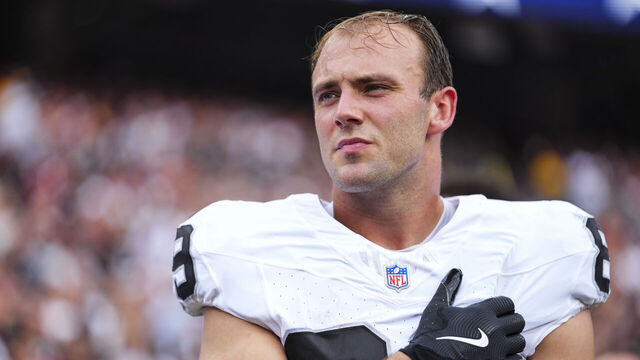 LANDOVER, MD - SEPTEMBER 21: Brock Bowers #89 of the Las Vegas Raiders looks on from the sideline during the national anthem prior to an NFL football game against the Washington Commanders at Northwest Stadium on September 21, 2025 in Landover, Maryland.