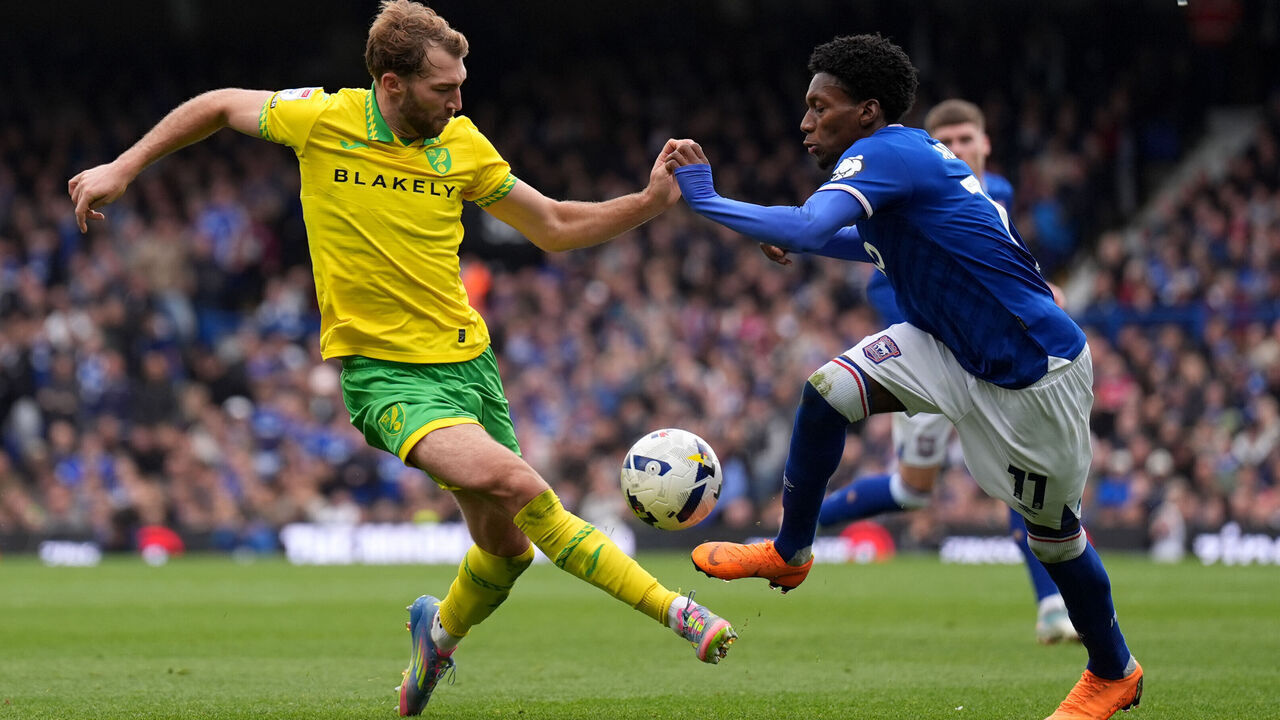 Norwich City's Jack Stacey (left) and Ipswich Town's Jaden Philogene-Bidace battle for the ball during the Sky Bet Championship match at Portman Road, Ipswich. Picture date: Sunday October 5, 2025.