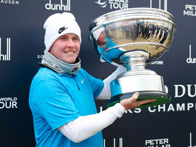 ST ANDREWS, SCOTLAND - OCTOBER 05: Robert MacIntyre of Scotland lifts the trophy after winning the Alfred Dunhill Links Championship during Day Four of the Alfred Dunhill Links Championship 2025 at St Andrews Old Course, on October 05, 2025, in St Andrews, Scotland.