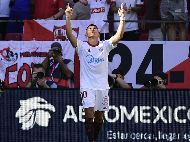 Sevilla's Chilean forward #10 Alexis Sanchez celebrates scoring the opening goal during the Spanish league football match between Sevilla FC and FC Barcelona at Ramon Sanchez Pizjuan Stadium in Seville on October 5, 2025.