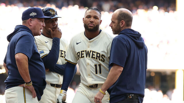 MILWAUKEE, WISCONSIN - OCTOBER 04: Jackson Chourio #11 of the Milwaukee Brewers talks with manager Pat Murphy #49 after being injured against the Chicago Cubs during the second inning in Game One of the National League Division Series at American Family Field on October 04, 2025 in Milwaukee, Wisconsin.