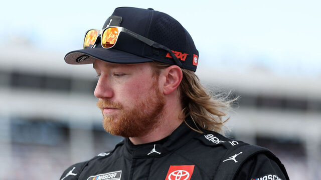 CONCORD, NORTH CAROLINA - OCTOBER 04: Tyler Reddick, driver of the #45 Jordan Brand Toyota, walks the grid after winning the pole award during qualifying for the NASCAR Cup Series Bank of America ROVAL 400 at Charlotte Motor Speedway on October 04, 2025 in Concord, North Carolina.