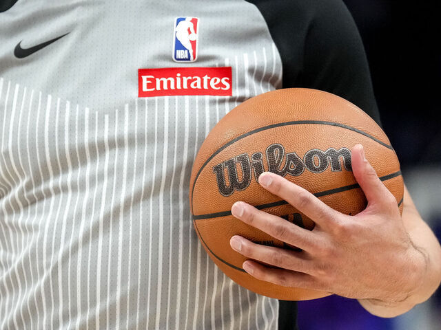DETROIT, MICHIGAN - MARCH 11: A referee holds a Wilson brand official NBA game ball basketball during the game between the Detroit Pistons and Washington Wizards at Little Caesars Arena on March 11, 2025 in Detroit, Michigan.