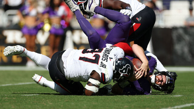 BALTIMORE, MARYLAND - OCTOBER 05: Mario Edwards #97 of the Houston Texans sacks Cooper Rush #15 of the Baltimore Ravens during the second quarter in the game at M&T Bank Stadium on October 05, 2025 in Baltimore, Maryland.