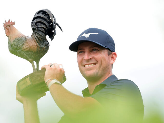 JACKSON, MISSISSIPPI - OCTOBER 05: Steven Fisk of the United States poses with the trophy on the 18th green after his winning putt during the final round of the Sanderson Farms Championship 2025 at The Country Club of Jackson on October 05, 2025 in Jackson, Mississippi.