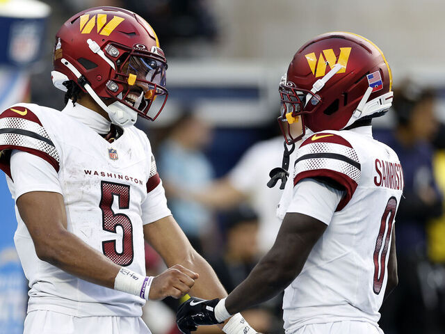 INGLEWOOD, CALIFORNIA - OCTOBER 05: Jayden Daniels #5 and Mike Sainristil #0 of the Washington Commanders celebrate a fourth quarter touchdown against the Los Angeles Chargers at SoFi Stadium on October 05, 2025 in Inglewood, California.