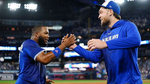TORONTO, ON - OCTOBER 05: Vladimir Guerrero Jr. #27 and Trey Yesavage #39 of the Toronto Blue Jays celebrate after winning Game Two of the American League Division Series presented by Booking.com between the New York Yankees and the Toronto Blue Jays at Rogers Centre on Sunday, October 5, 2025 in Toronto, Ontario, Canada.