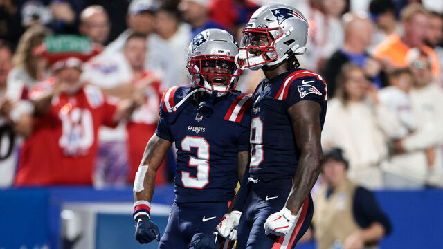 ORCHARD PARK, NEW YORK - OCTOBER 5: Stefon Diggs #8 and DeMario Douglas #3 of the New England Patriots react after a first down during the third quarter against the Buffalo Bills at Highmark Stadium on October 5, 2025 in Orchard Park, New York.