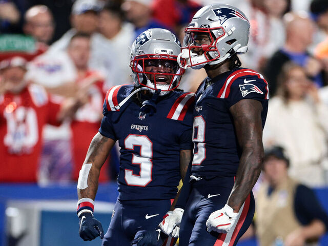 ORCHARD PARK, NEW YORK - OCTOBER 5: Stefon Diggs #8 and DeMario Douglas #3 of the New England Patriots react after a first down during the third quarter against the Buffalo Bills at Highmark Stadium on October 5, 2025 in Orchard Park, New York.