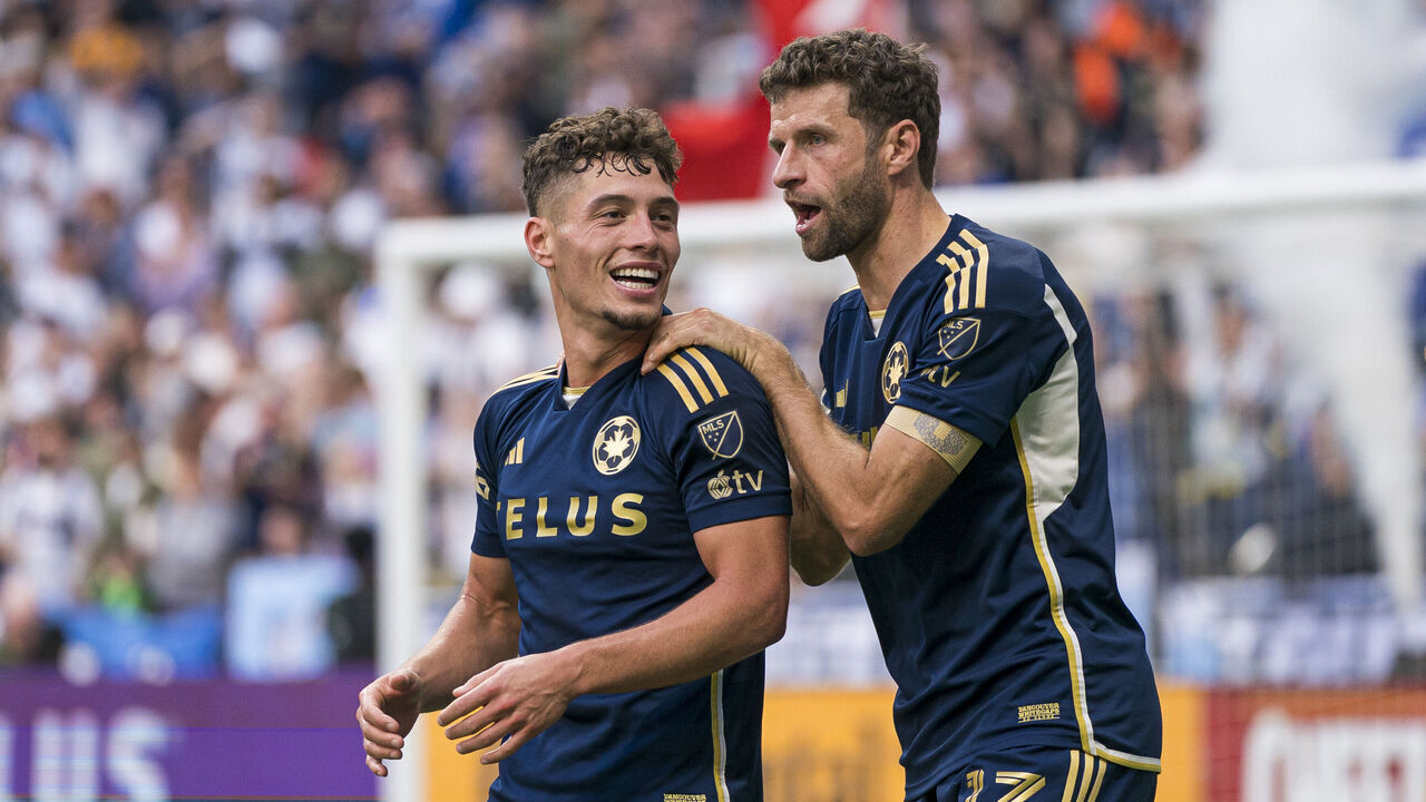 VANCOUVER, CANADA - OCTOBER 5: Sebastian Berhalter #16 of the Vancouver Whitecaps is congratulated by teammate Thomas Muller #13 after scoring a goal against the San Jose Earthquakes during the second half of MLS action at BC Place on October 5, 2025 in Vancouver, Canada.