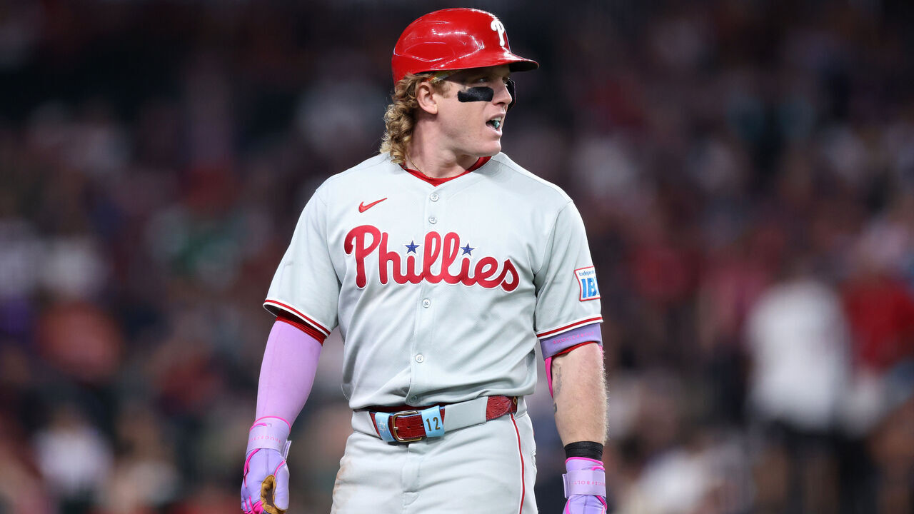 PHOENIX, ARIZONA - SEPTEMBER 21: Harrison Bader #2 of the Philadelphia Phillies walks off the field after hitting a li out during the fifth inning against the Arizona Diamondbacks at Chase Field on September 21, 2025 in Phoenix, Arizona. The Diamondbacks defeated the Phillies 9-2.