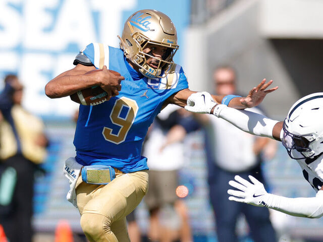PASADENA, CA - OCTOBER 04: UCLA Bruins quarterback Nico Iamaleava (9) fends off Penn State Nittany Lions safety King Mack (16) during the college football game between the Penn State Nittany Lions and the UCLA Bruins on October 04, 2025, at the Rose Bowl in Pasadena, CA.