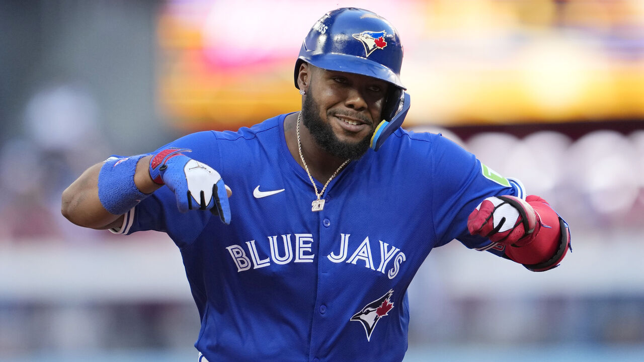 TORONTO, ONTARIO - OCTOBER 05: Vladimir Guerrero Jr. #27 of the Toronto Blue Jays celebrates after a grand slam during the fourth inning in game two of the American League Division Series against the New York Yankees at Rogers Centre on October 05, 2025 in Toronto, Ontario.