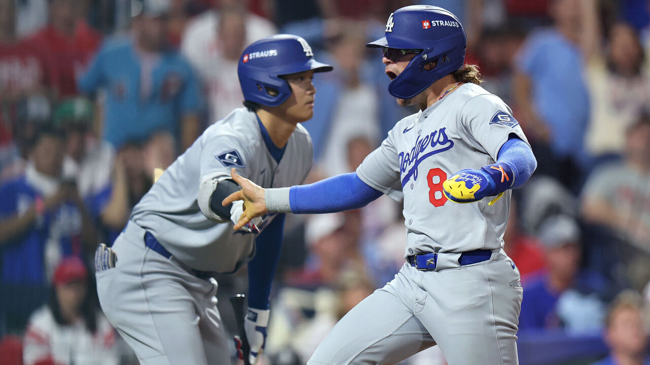 PHILADELPHIA, PENNSYLVANIA - OCTOBER 06: Enrique Hernandez #8 of the Los Angeles Dodgers is congratulated by Shohei Ohtani #17 after scoring a run during the seventh inning against the Philadelphia Phillies in game two of the National League Division Series at Citizens Bank Park on October 06, 2025 in Philadelphia, Pennsylvania.