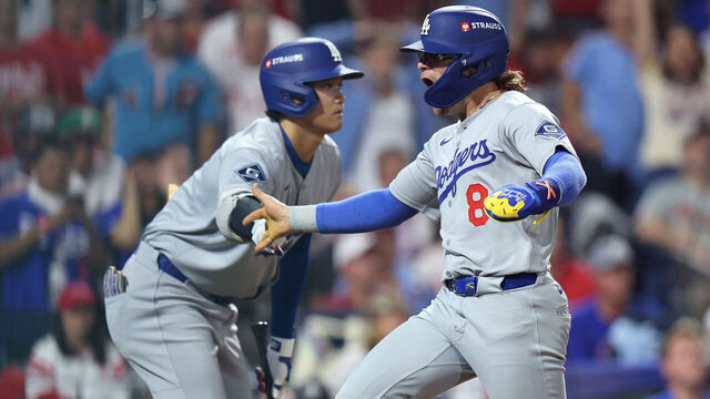 PHILADELPHIA, PENNSYLVANIA - OCTOBER 06: Enrique Hernandez #8 of the Los Angeles Dodgers is congratulated by Shohei Ohtani #17 after scoring a run during the seventh inning against the Philadelphia Phillies in game two of the National League Division Series at Citizens Bank Park on October 06, 2025 in Philadelphia, Pennsylvania.