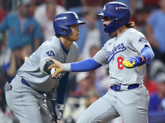 PHILADELPHIA, PENNSYLVANIA - OCTOBER 06: Enrique Hernandez #8 of the Los Angeles Dodgers is congratulated by Shohei Ohtani #17 after scoring a run during the seventh inning against the Philadelphia Phillies in game two of the National League Division Series at Citizens Bank Park on October 06, 2025 in Philadelphia, Pennsylvania.
