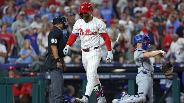 PHILADELPHIA, PENNSYLVANIA - OCTOBER 06: Bryce Harper #3 of the Philadelphia Phillies walks to the dugout after striking out during the sixth inning against the Los Angeles Dodgers in game two of the National League Division Series at Citizens Bank Park on October 06, 2025 in Philadelphia, Pennsylvania.