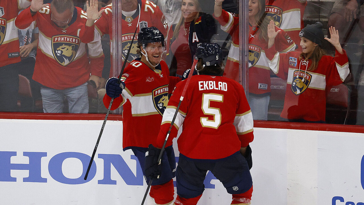 SUNRISE, FLORIDA - OCTOBER 7: Jesper Boqvist #70 of the Florida Panthers celebrates his goal with teammate Aaron Ekblad #5 during the third period against the Chicago Blackhawks at the Amerant Bank Arena on October 7, 2025 in Sunrise, Florida.