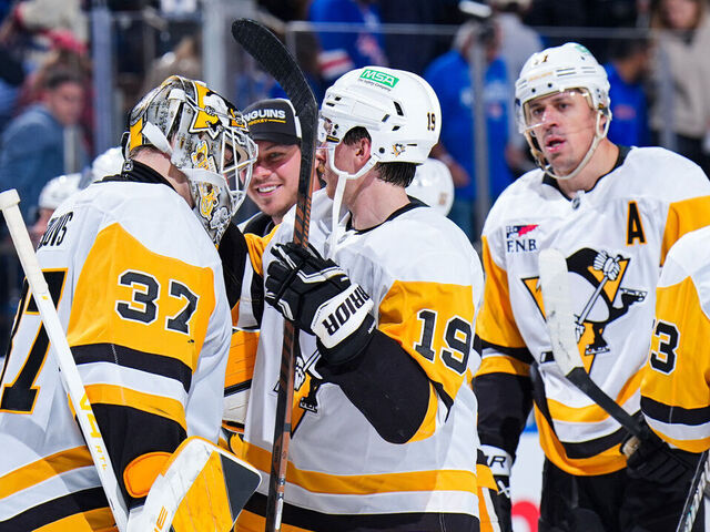 NEW YORK, NEW YORK - OCTOBER 07: Arturs Silovs #37 of the Pittsburgh Penguins celebrates with teammates after a 3-0 win against the New York Rangers at Madison Square Garden on October 7, 2025 in New York City.