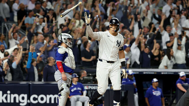 NEW YORK, NEW YORK - OCTOBER 07: Aaron Judge #99 of the New York Yankees celebrates hitting a three-run home run against the Toronto Blue Jays during the fourth inning in game three of the American League Division Series at Yankee Stadium on October 07, 2025 in the Bronx borough of New York City.