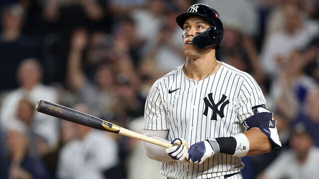 NEW YORK, NEW YORK - OCTOBER 07: Aaron Judge #99 of the New York Yankees hits a three-run home run against the Toronto Blue Jays during the fourth inning in game three of the American League Division Series at Yankee Stadium on October 07, 2025 in the Bronx borough of New York City.