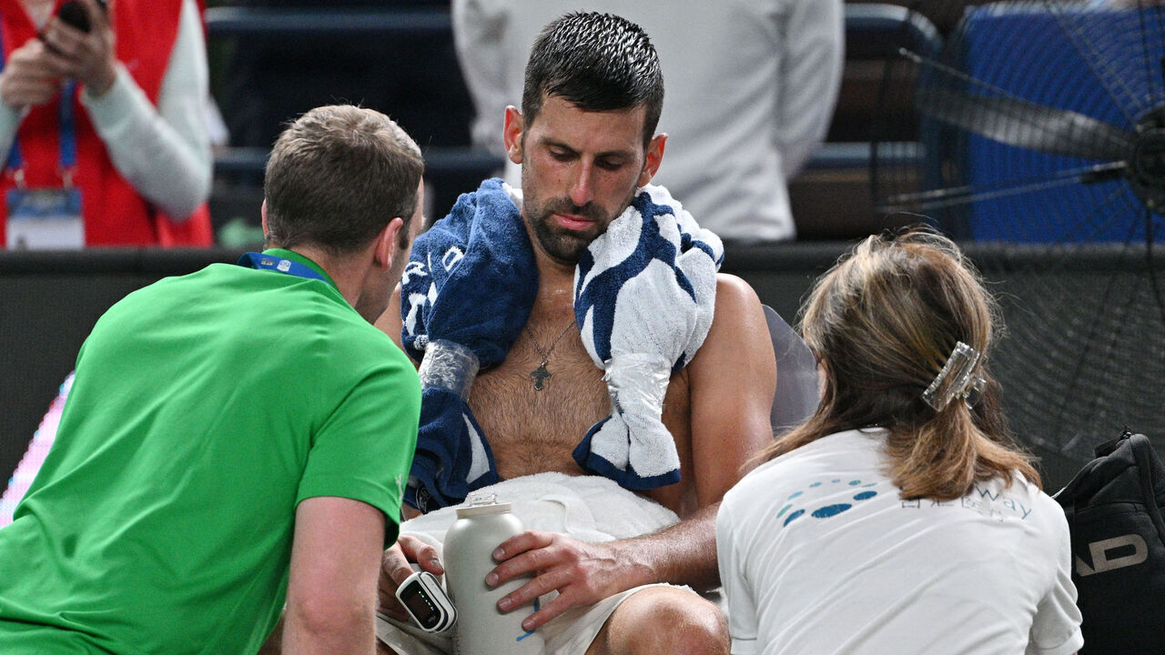Serbia's Novak Djokovic receives medical attention during his men's singles match against Spain's Jaume Munar at the Shanghai Masters tennis tournament in Shanghai on October 7, 2025.